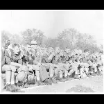 President Edman on the bench with the football team