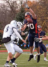 Dougan blocks against Elmhurst, 2009